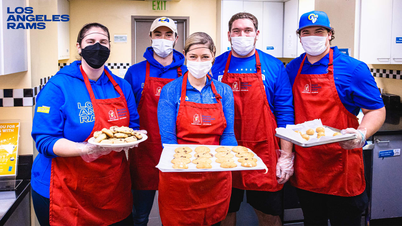 COMMUNITY PHOTOS Rams staff cook & serve meals while volunteering at