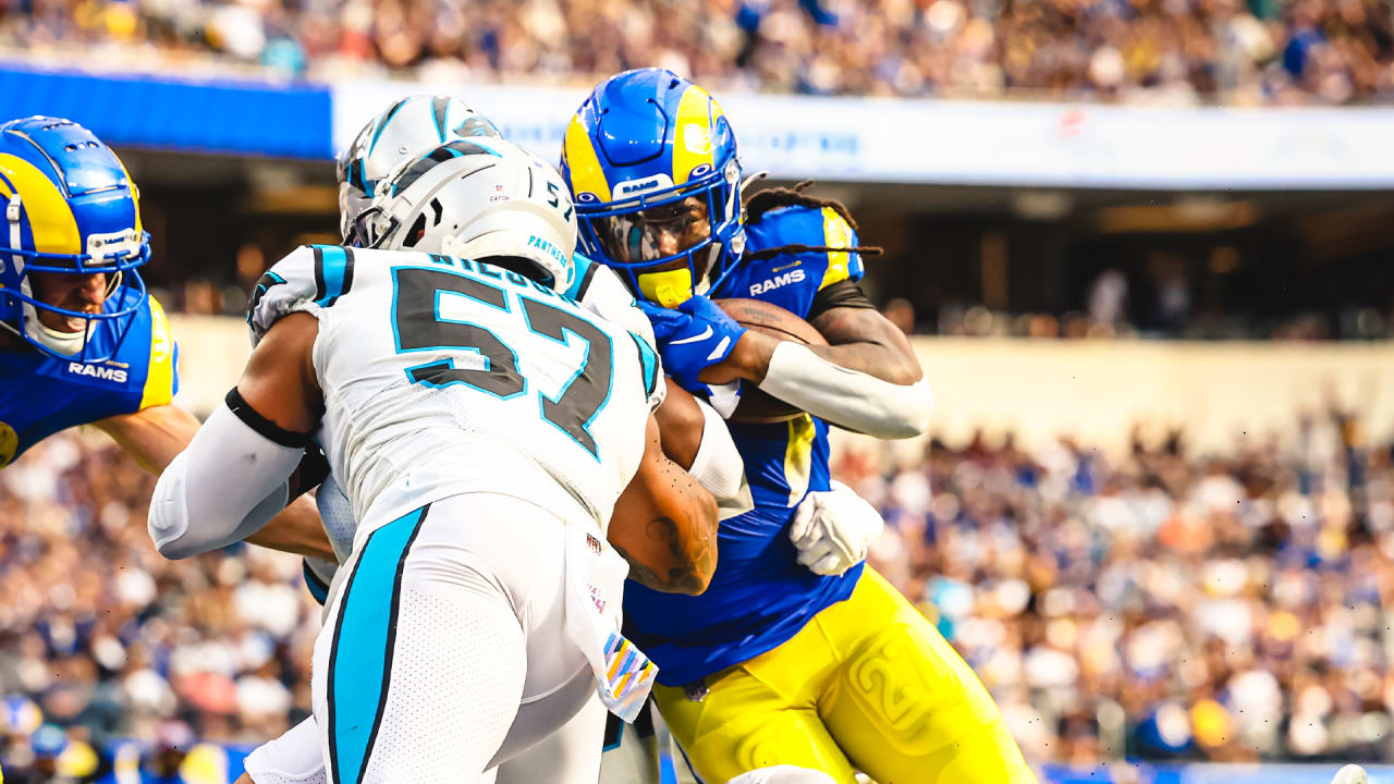 Los Angeles Rams running back Darrell Henderson Jr. pushes over the goal  line for a rushing touchdown