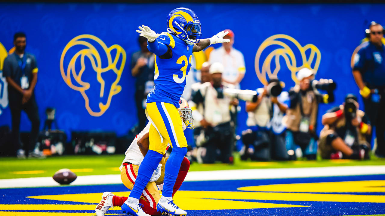 Los Angeles Rams defensive back Nick Scott breaks up Jimmy Garoppolo's