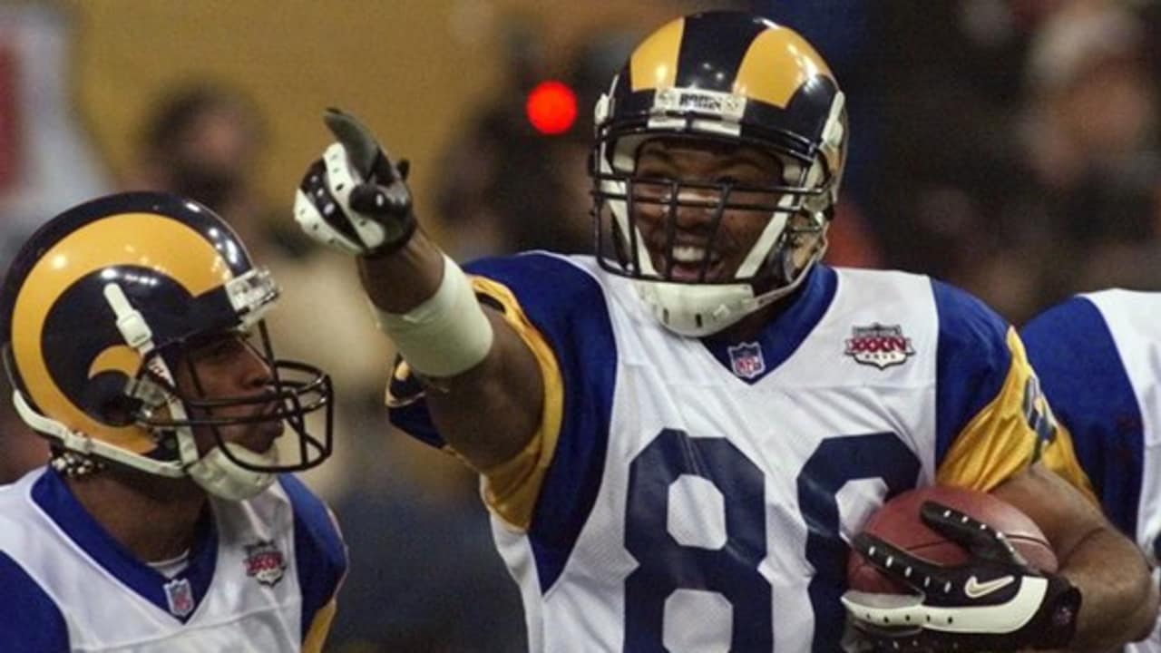 St. Louis Rams wide receiver Torry Holt, right, congratulates rookie wide  receiver Kelvin Kight after Kight made a great reception during the Rams'  minicamp Saturday, May 22, 2004, in Earth City, Mo. (