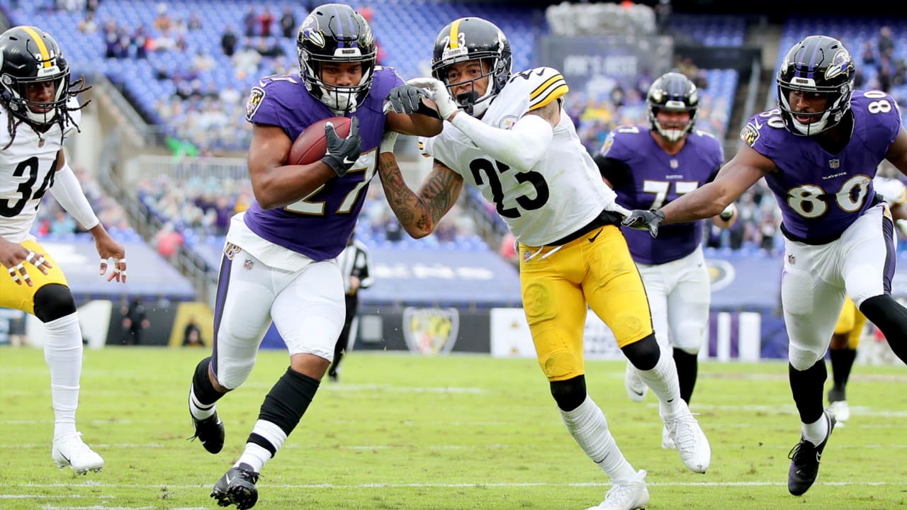 Baltimore Ravens running back J.K. Dobbins (27) celebrates a touchdown  during the first half of an NFL football game against the Pittsburgh  Steelers in Pittsburgh, Sunday, Dec. 11, 2022. (AP Photo/Don Wright