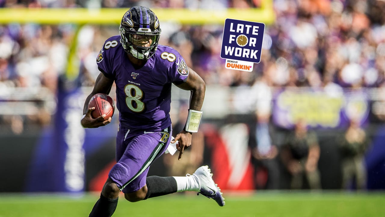 AFC defensive end Calais Campbell of the Jacksonville Jaguars is named  defensive player of the game while he holds the Pro Bowl trophy with  quarterback Lamar Jackson of the Baltimore Ravens (8)