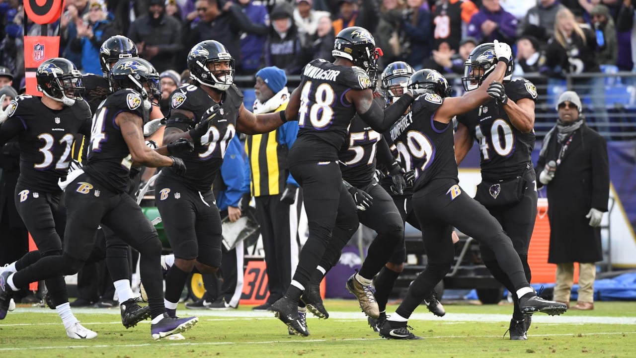 Ravens clinch playoffs with 21-13 win over Raiders 