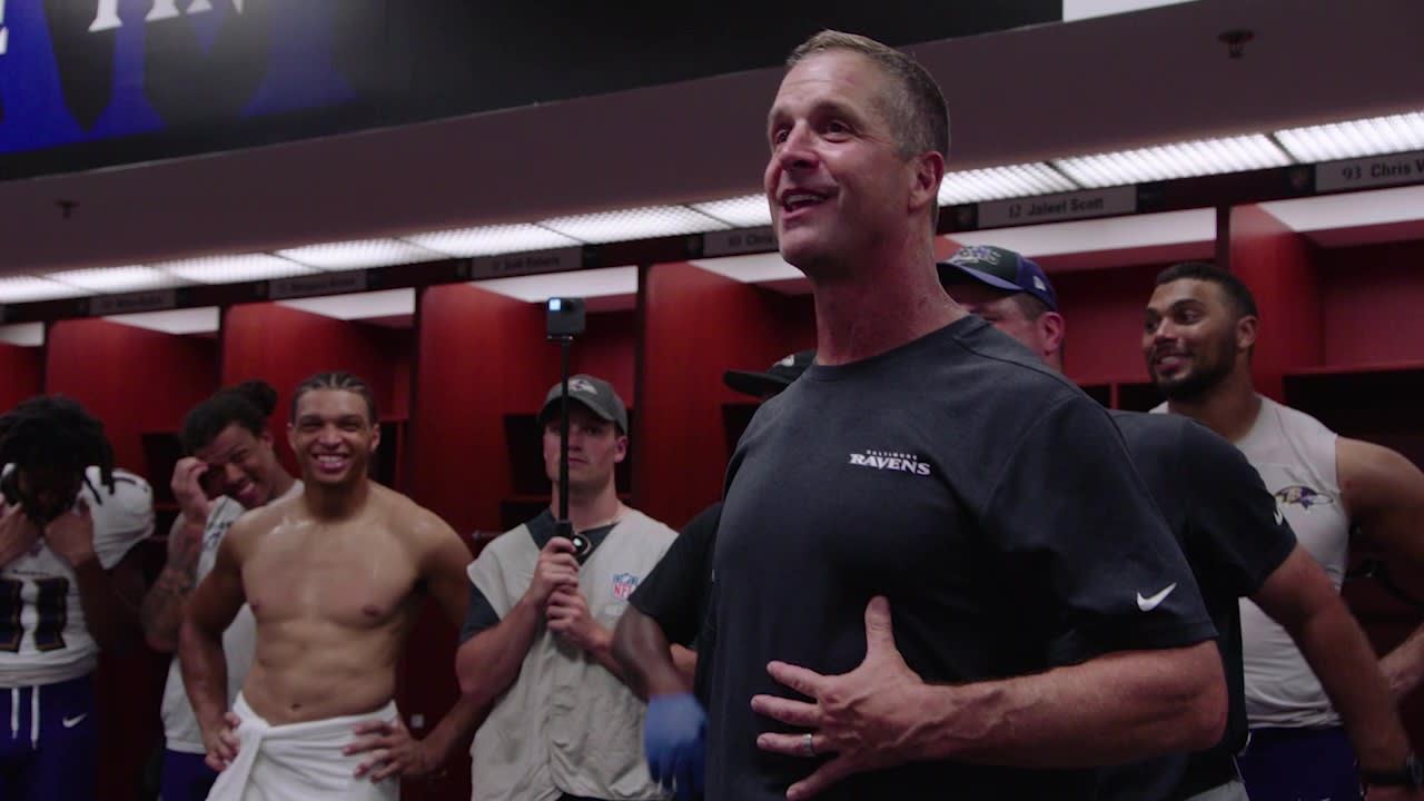 Coach Harbaugh gives Ray Lewis the game ball in the post-game locker room.  (1-6-13)