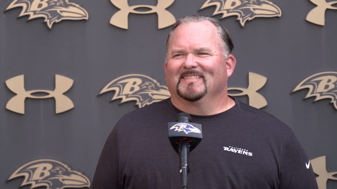 Baltimore Ravens offensive coordinator Greg Roman, center, talks