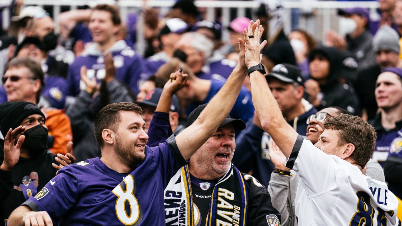 With their left hands up, Commanders fans flock to a new anthem