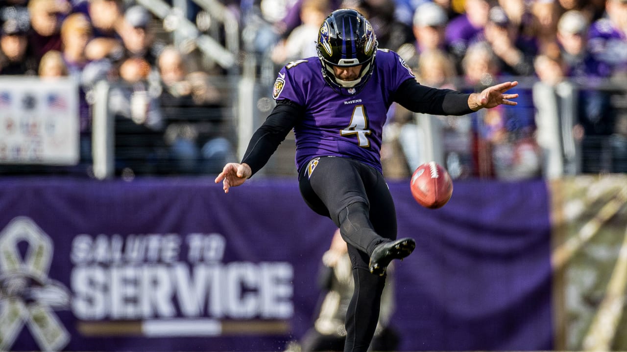 Ravens special teams consultant Sam Koch coaches up P Jordan Stout