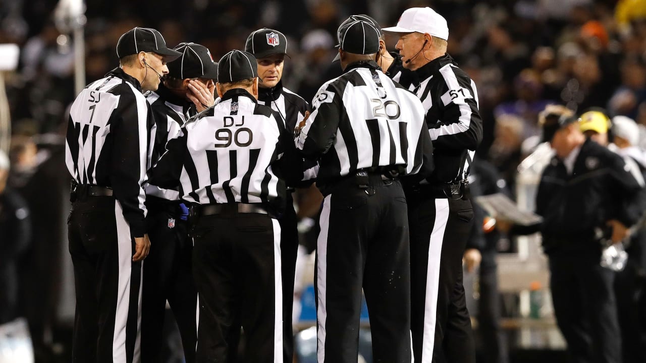 New Orleans Saints fans react to a replay call during the second