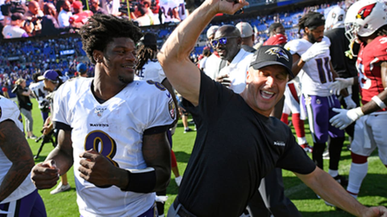 Ravens WR coach Greg Lewis describes bond with HC John Harbaugh