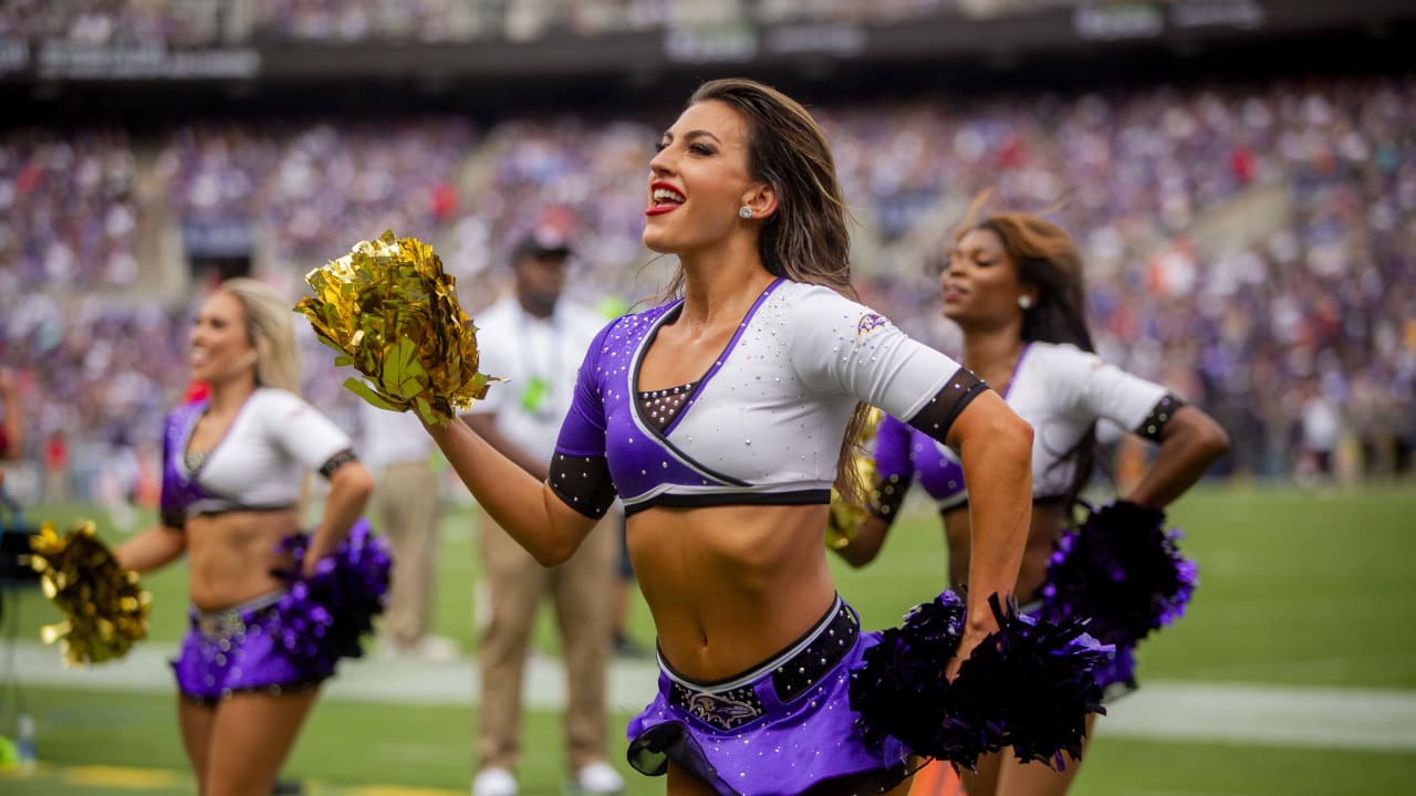 A Baltimore Ravens cheerleader battles the wind during a performance  against the Philadelphia Eagles during the first half of their NFL game at  M&T Bank Stadium in Baltimore, Maryland, December 18, 2016.