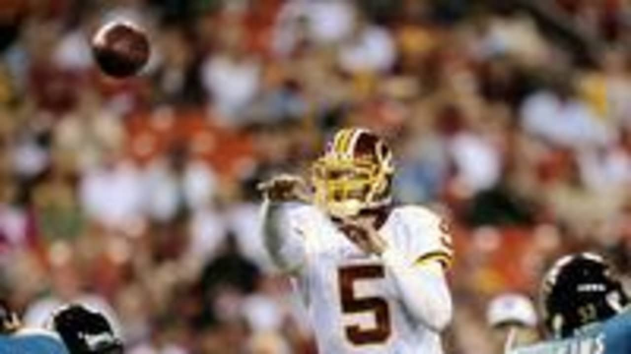 Quarterback Colt Brennan of the Washington Redskins rolls out