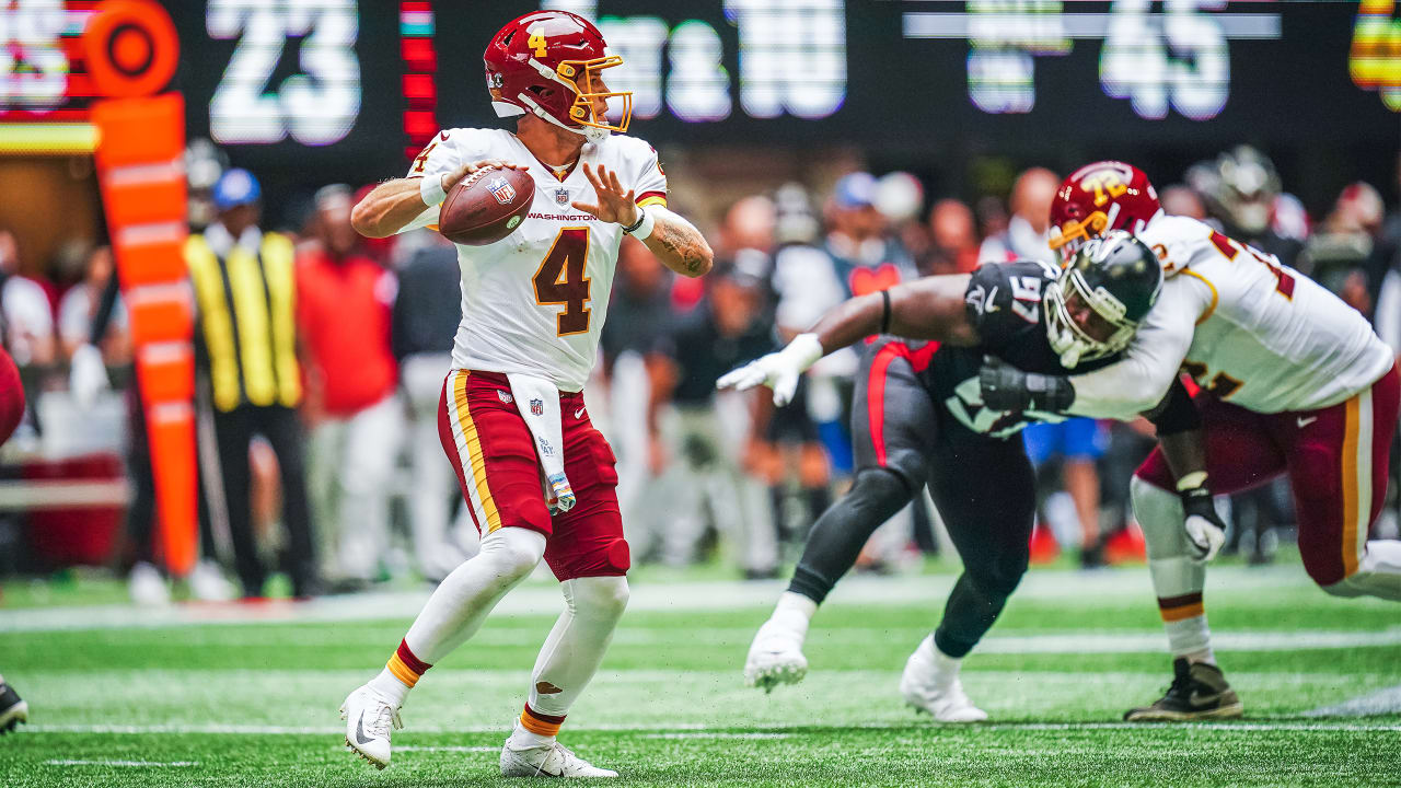 Washington Football Team quarterback Taylor Heinicke (4) dives towards the  end zone to score a …