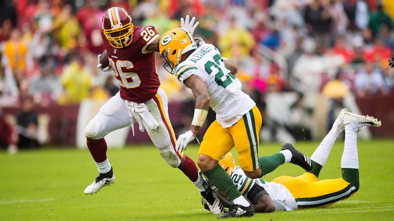 Redskins running back John Riggins runs for short yardage near the