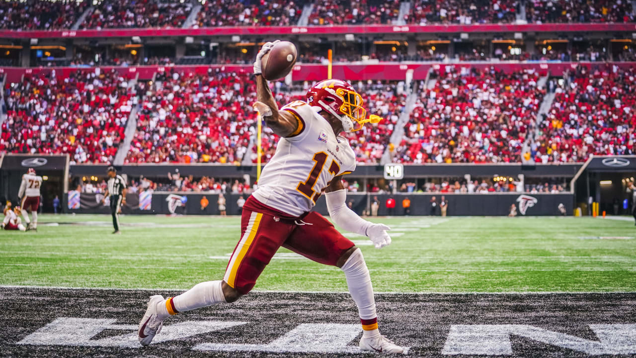 Washington Football Team wide receiver Terry McLaurin (17) spikes the ball  after scoring a touchdown during the second half of an NFL football game  against the Atlanta Falcons, Sunday, Oct. 3, 2021