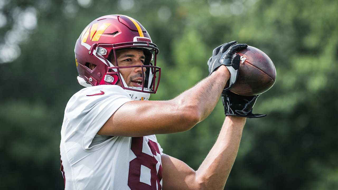 Washington Commanders tight end Logan Thomas makes a leaping grab