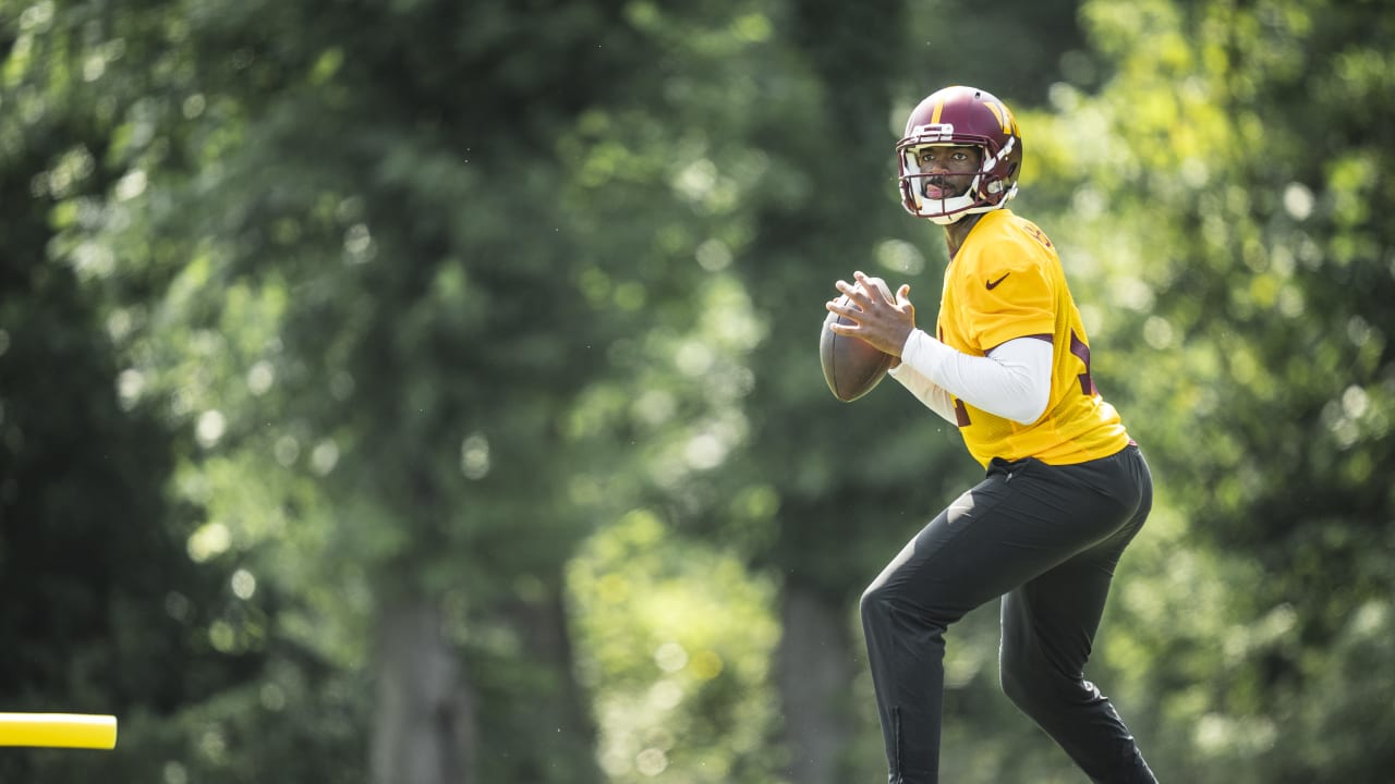 Washington Commanders quarterback Jacoby Brissett signs fan merchandise at  the end of a NFL football practice at the team's training facility, Friday,  July 28, 2023, in Ashburn, Va. (AP Photo/Stephanie Scarbrough Stock