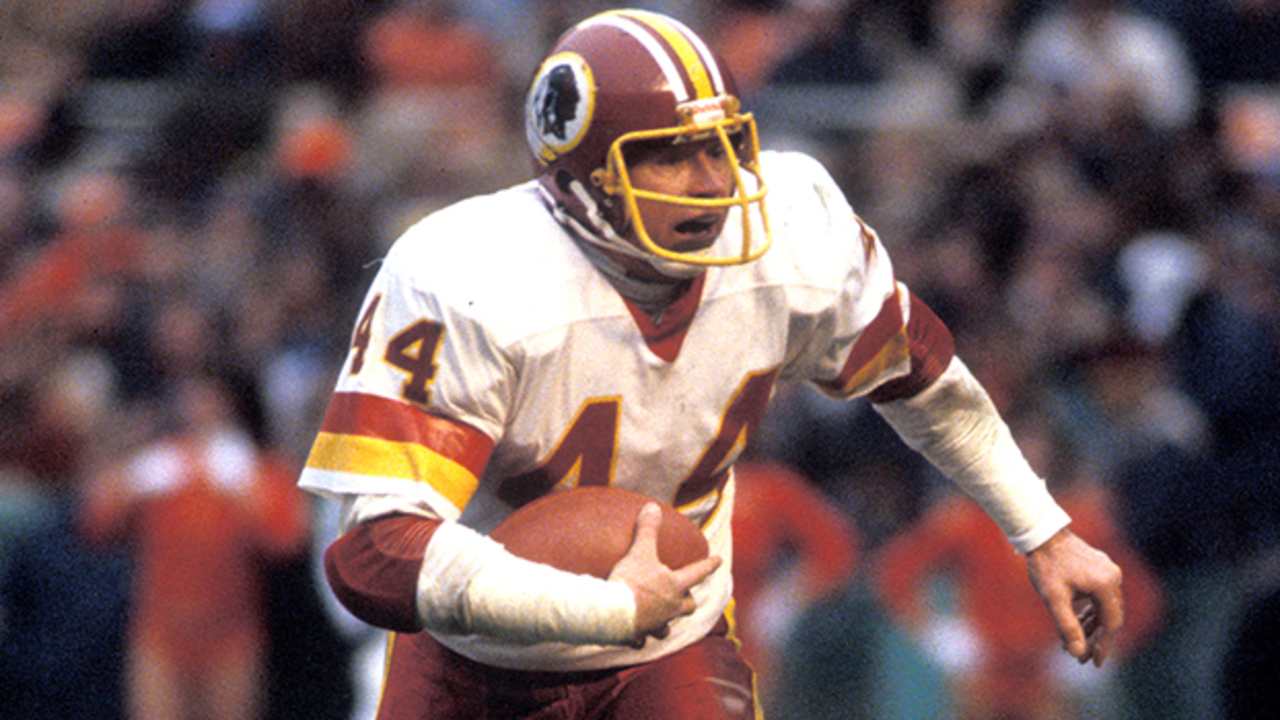 Washington Redskins Hall of Fame running back John Riggins tries