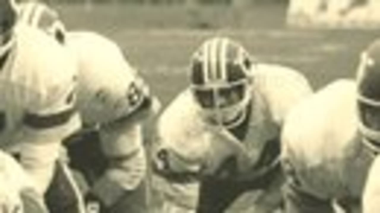 Washington Redskins' full back John Riggins (44) is slowed down