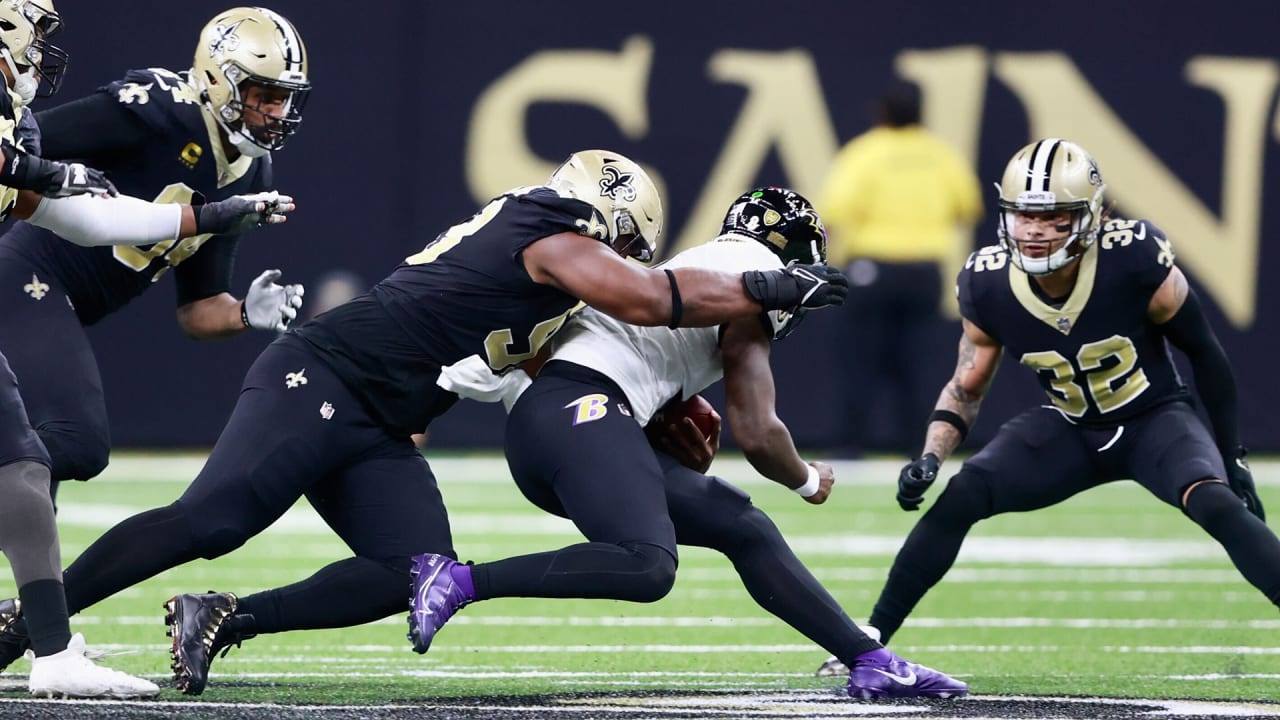 Baltimore Ravens quarterback Lamar Jackson has nowhere to go as he's  swarmed by New Orleans Saints on attempted QB keeper