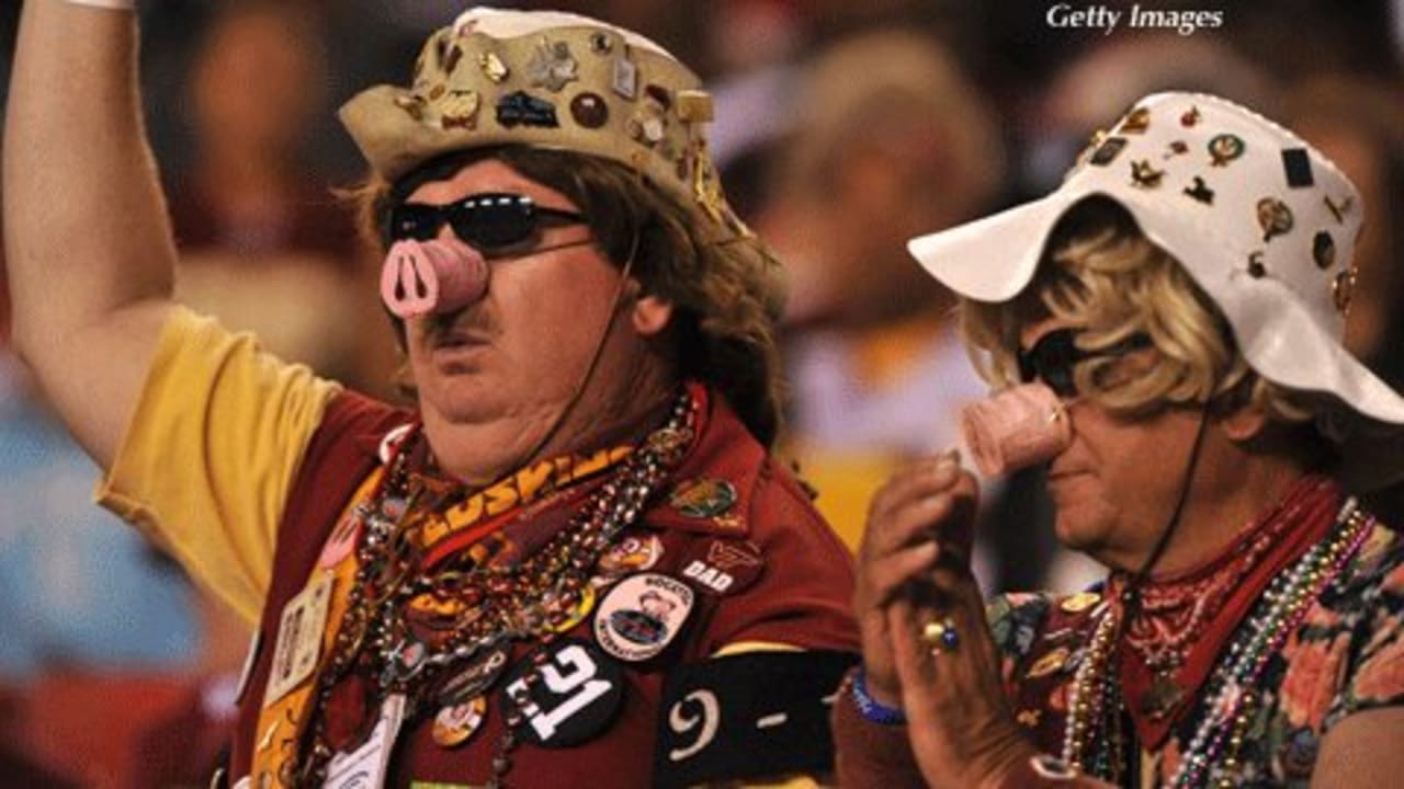 Former Washington Redskins head coach Jim Zorn, left, is all