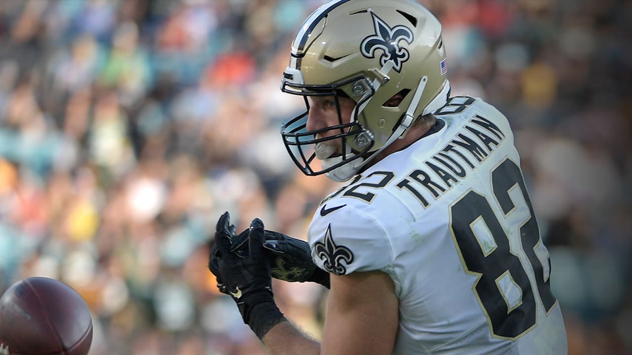 New Orleans Saints tight end Adam Trautman (82) runs the ball up