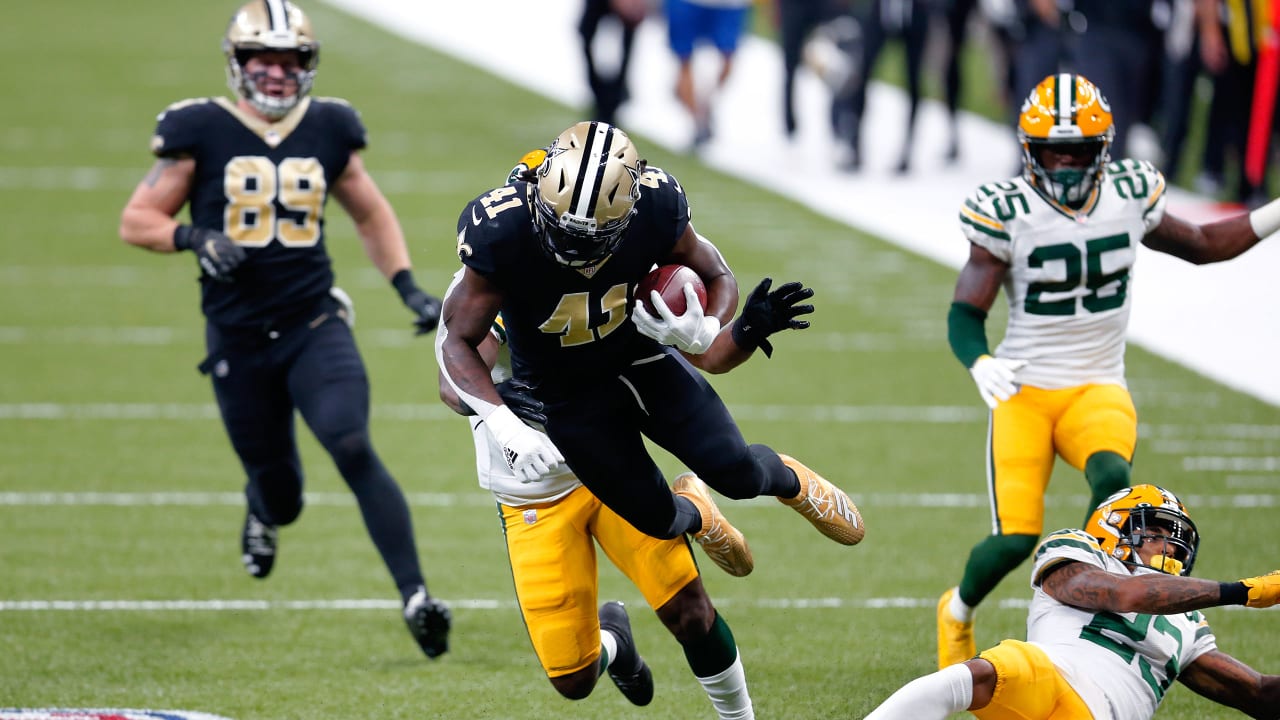 New Orleans Saints running back Alvin Kamara (41) and outside linebacker  Demario Davis (56) celebrate a win after an NFL football game against the  Green Bay Packers, Sunday, Sep. 12, 2021, in