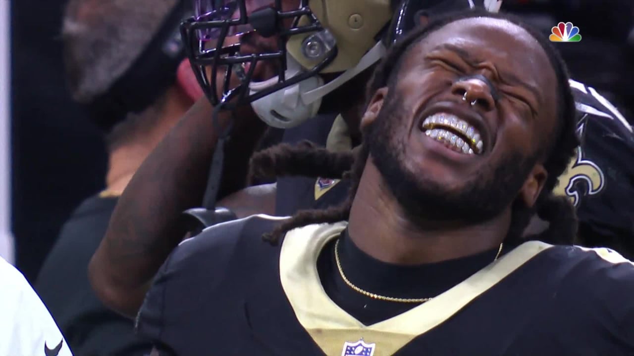 New Orleans Saints running back Alvin Kamara (41) and outside linebacker  Demario Davis (56) celebrate a win after an NFL football game against the  Green Bay Packers, Sunday, Sep. 12, 2021, in