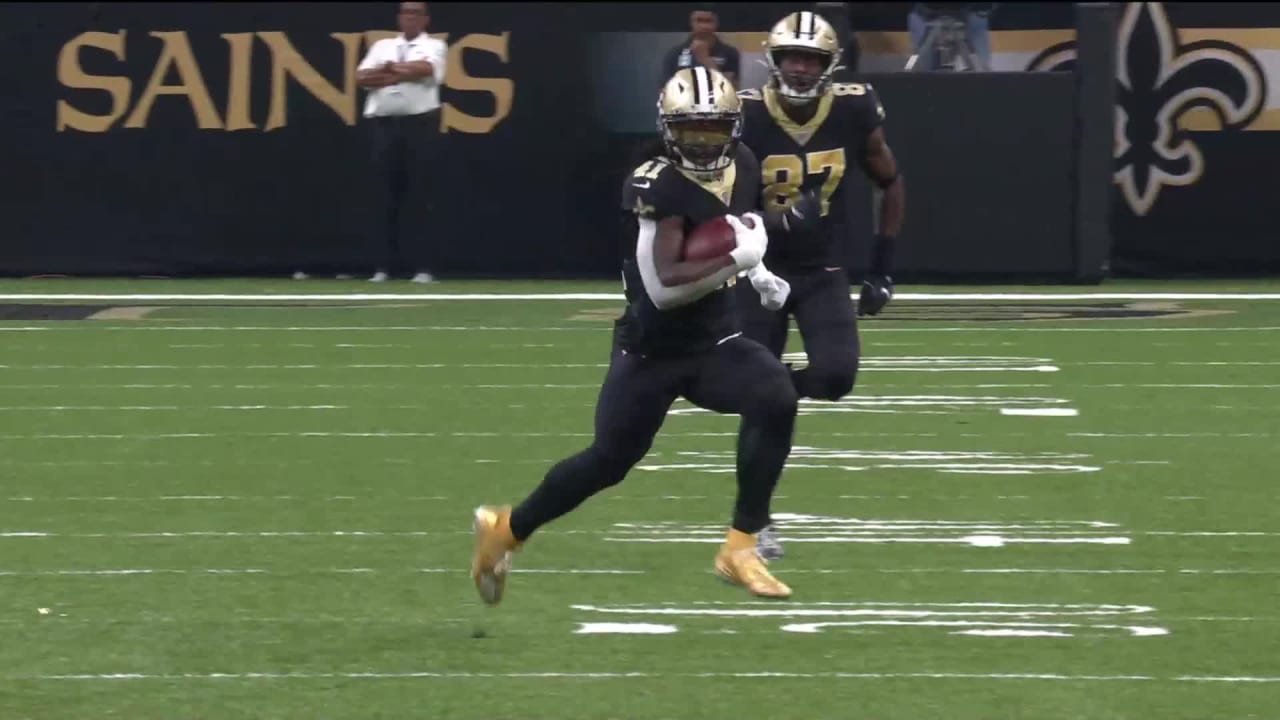 NFC running back Alvin Kamara of the New Orleans Saints (41) runs the ball  past AFC outside linebacker T.J. Watt of the Pittsburgh Steelers (90)  during the Pro Bowl NFL football game