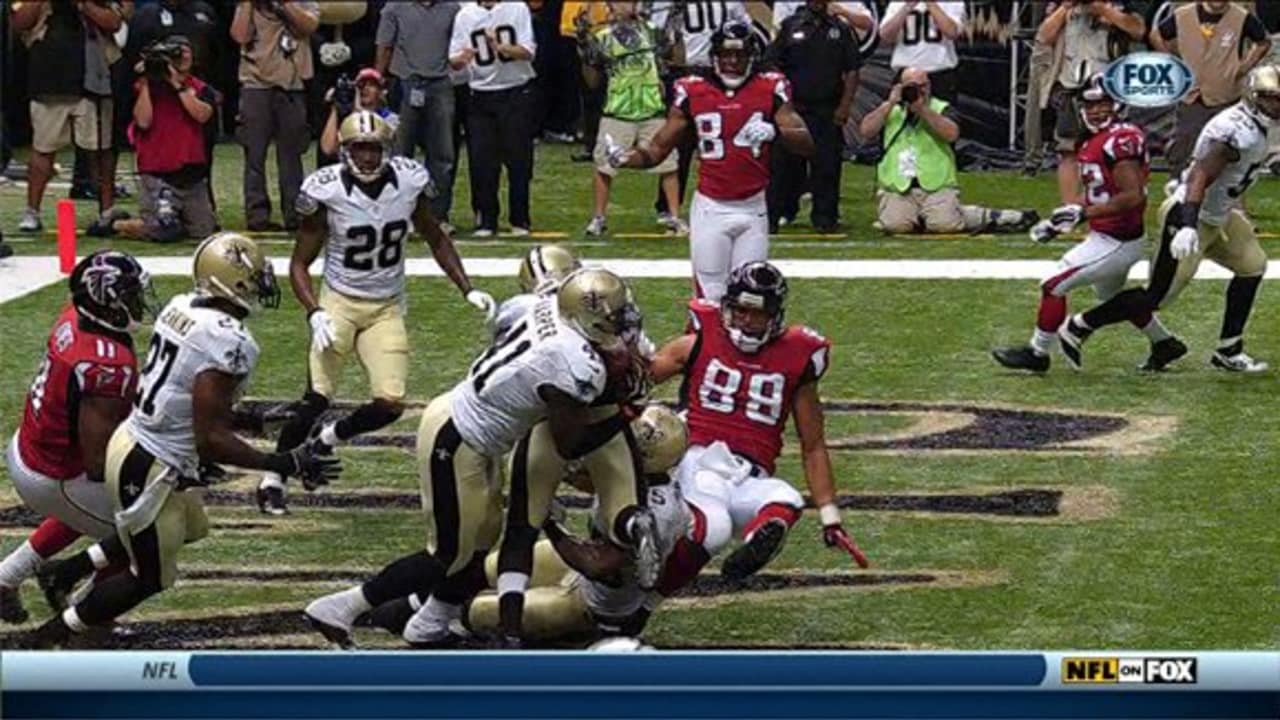 A stunned New Orleans Saints' Roman Harper walks off the field as the  Seattle Seahawks' celebrate their 41-36 win over the Super Bowl Defending  Champions in the NFC's wild-card playoff game on