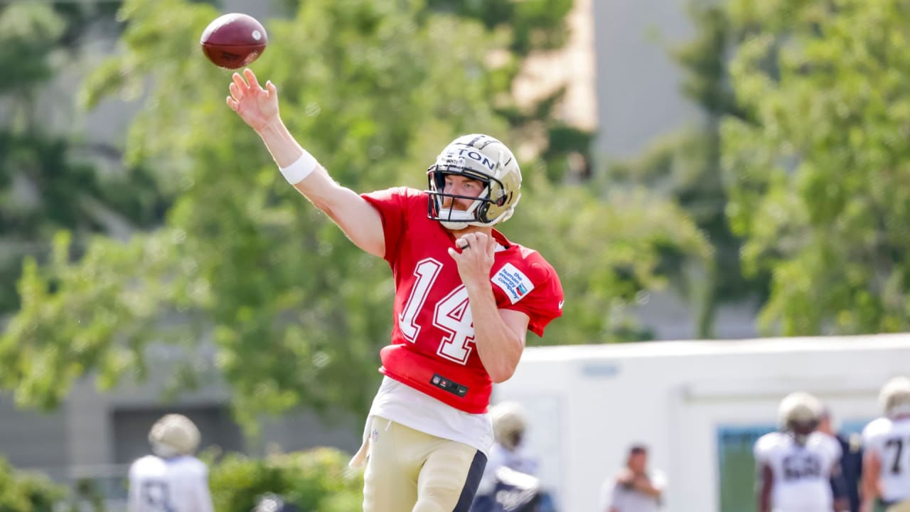 Andy Dalton of the New Orleans Saints scrambles with the ball in