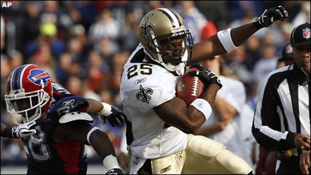 New Orleans Saints Scott Shanle jumps on Marques Colston after