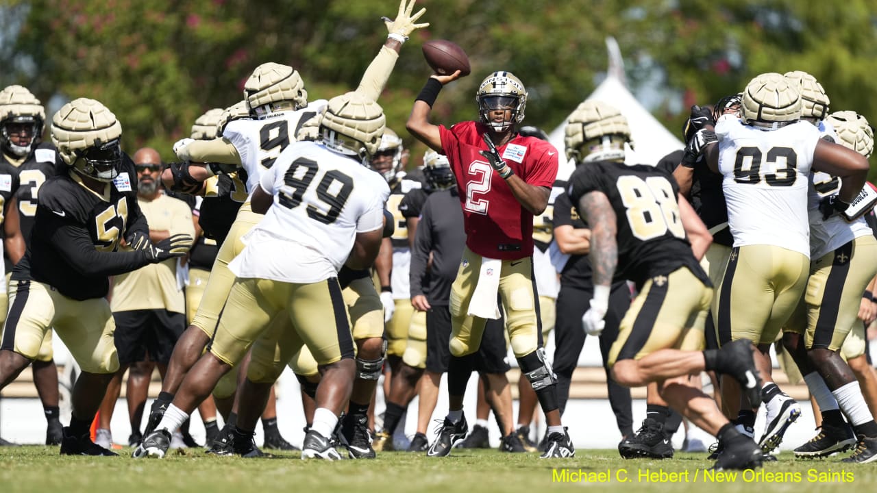 Running back Deuce McAllister of the New Orleans Saints stiff arms