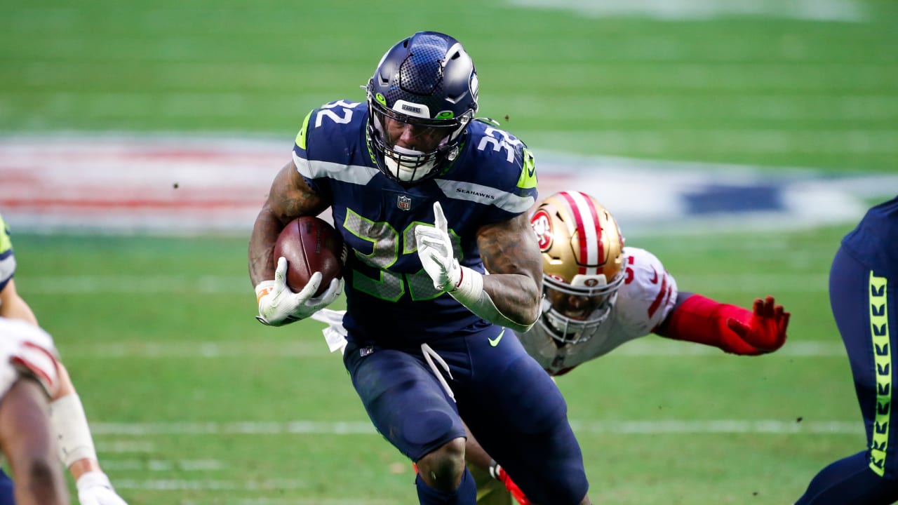 Running back Chris Carson of the Seattle Seahawks carries the ball in