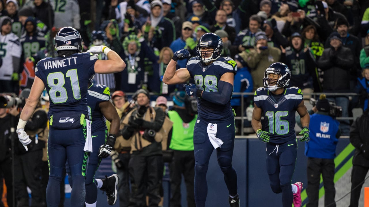 Seattle Seahawks tight end Nick Vannett (81) celebrates with a fan after he  scored a touchdown against the Kansas City Chiefs during the first half of  an NFL football game, Sunday, Dec.