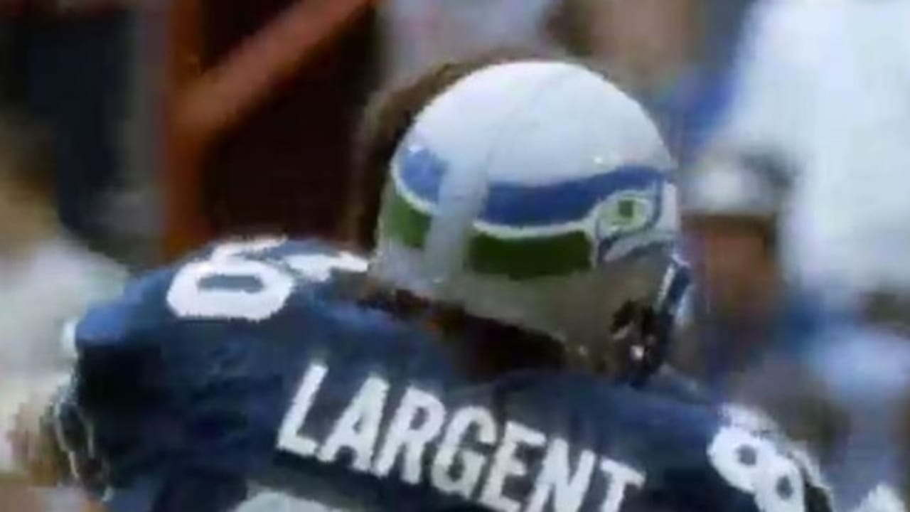 12th MAN Flag Raiser - 1983 Seattle Seahawk Team