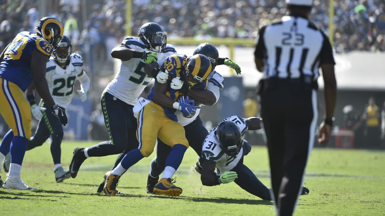 Christine Michael of the Green Bay Packers fends off a tackle