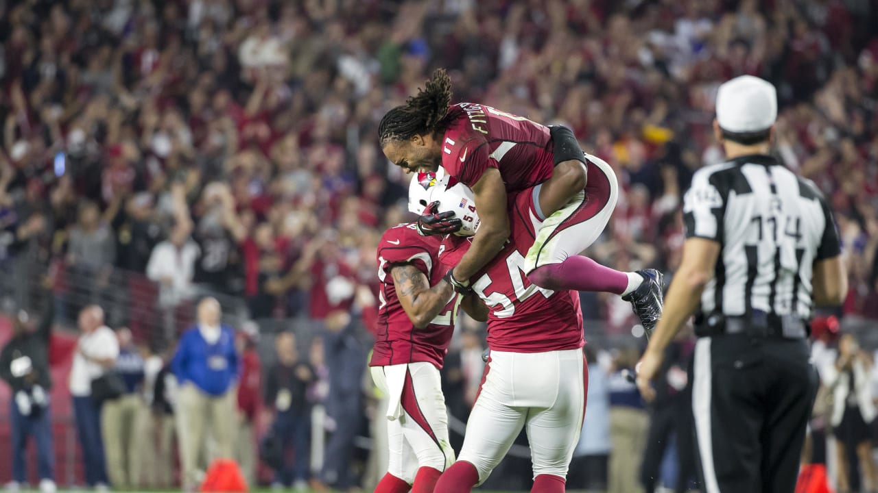 Seattle Seahawks cornerback Richard Sherman (25) and outside linebacker  K.J. Wright (50) team up to tackle Arizona Cardinals running back David  Johnson (31) at CenturyLink Field in Seattle, Washington on December 24