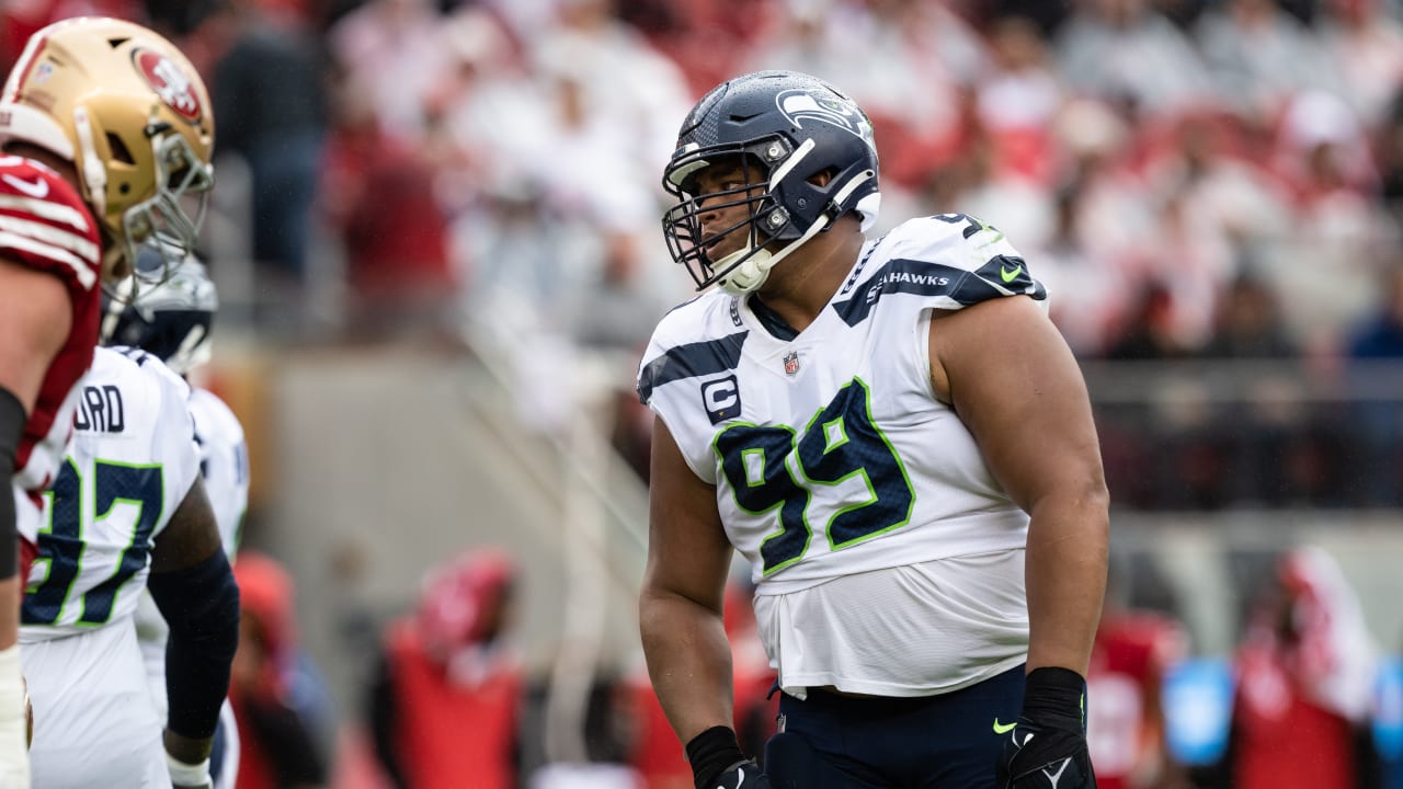 Seattle Seahawks defensive end Darrell Taylor (52) and defensive end L.J.  Collier celebrate during the first half of an NFL football game against the  Los Angeles Rams, Thursday, Oct. 7, 2021, in