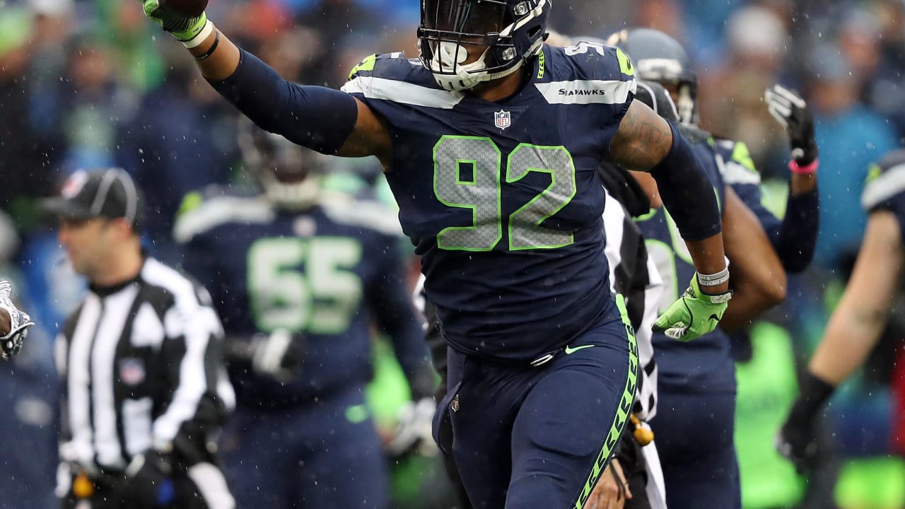 Seattle Seahawks tackle (92) Nazair Jones heads for the field for