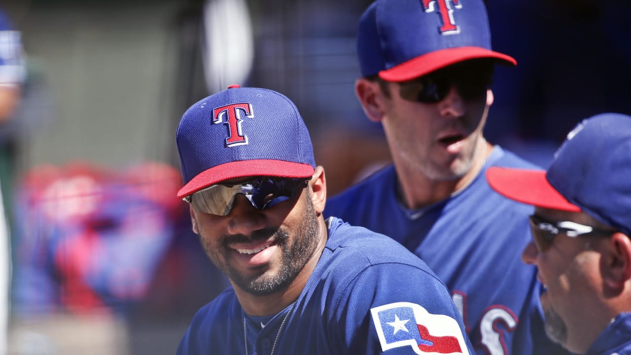 Seahawks' Russell Wilson suits up for Rangers baseball practice