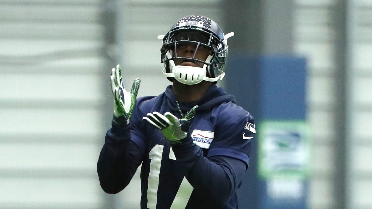 Chicago Bears' Devin Hester warms up before practice at team's