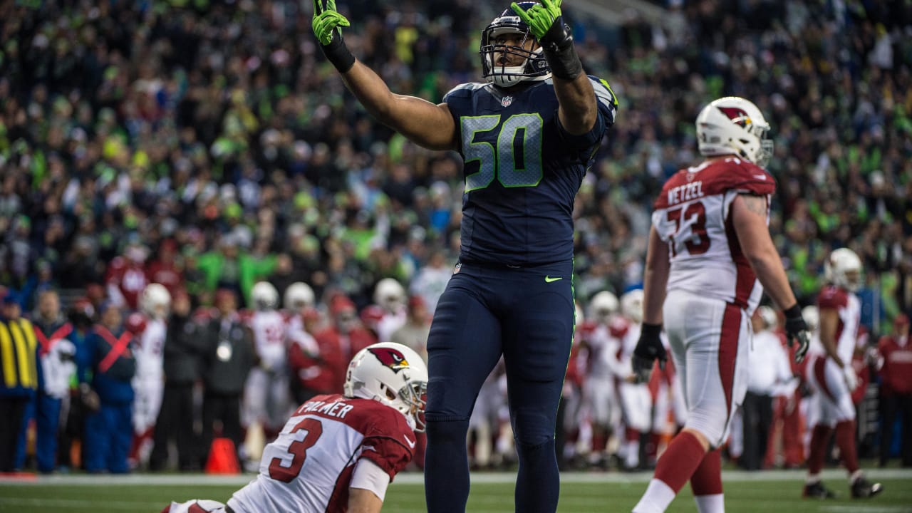 Seattle Seahawks including Thomas Rawls (34) and Cassius Marsh wear the NFL  color rush uniforms before an NFL football game against the Los Angeles  Rams, Thursday, Dec. 15, 2016, in Seattle. (AP