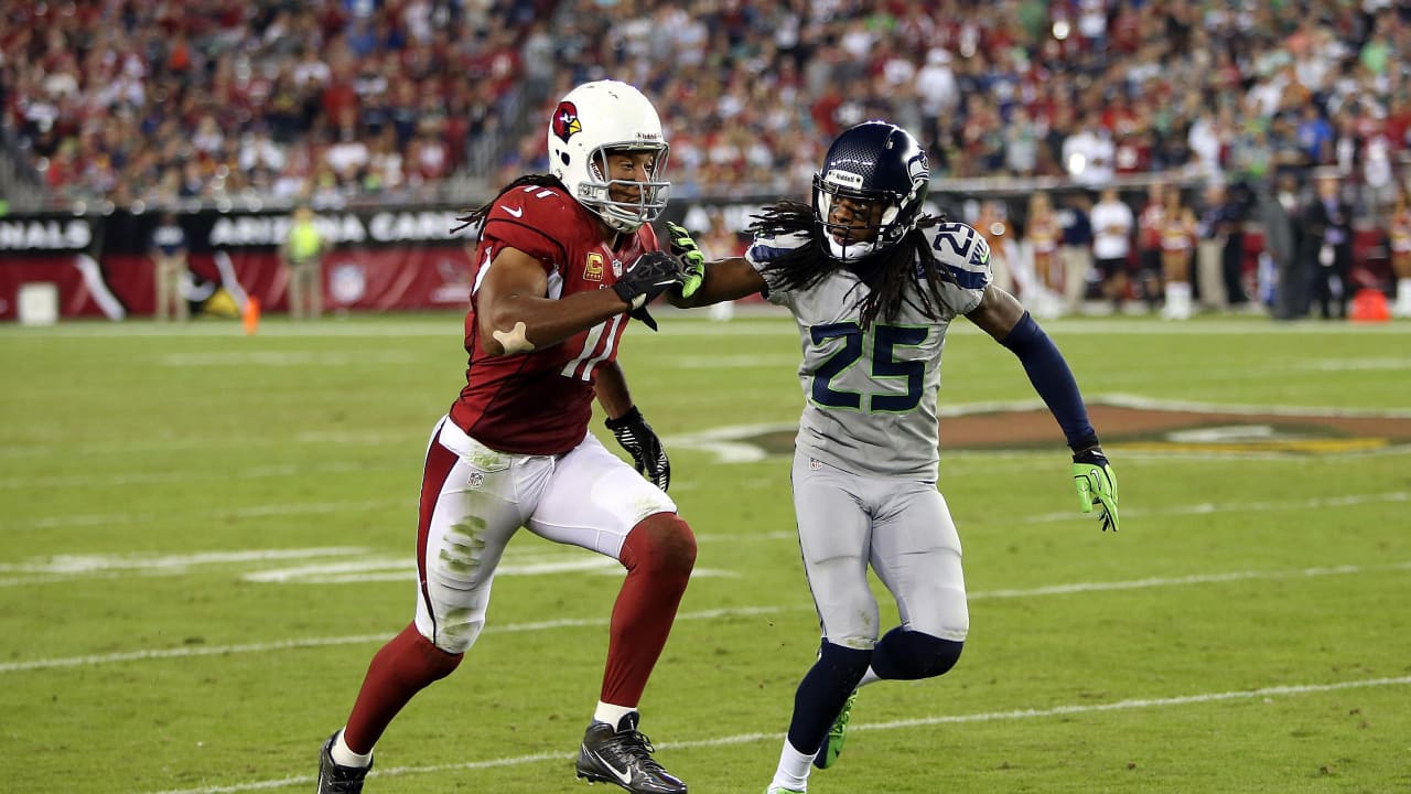 Seattle Seahawks' Richard Sherman, left, greets Arizona Cardinals' Larry  Fitzgerald after an NFL football game Sunday, Dec. 31, 2017, in Seattle.  Arizona won 26-24. (AP Photo/Elaine Thompson Stock Photo - Alamy