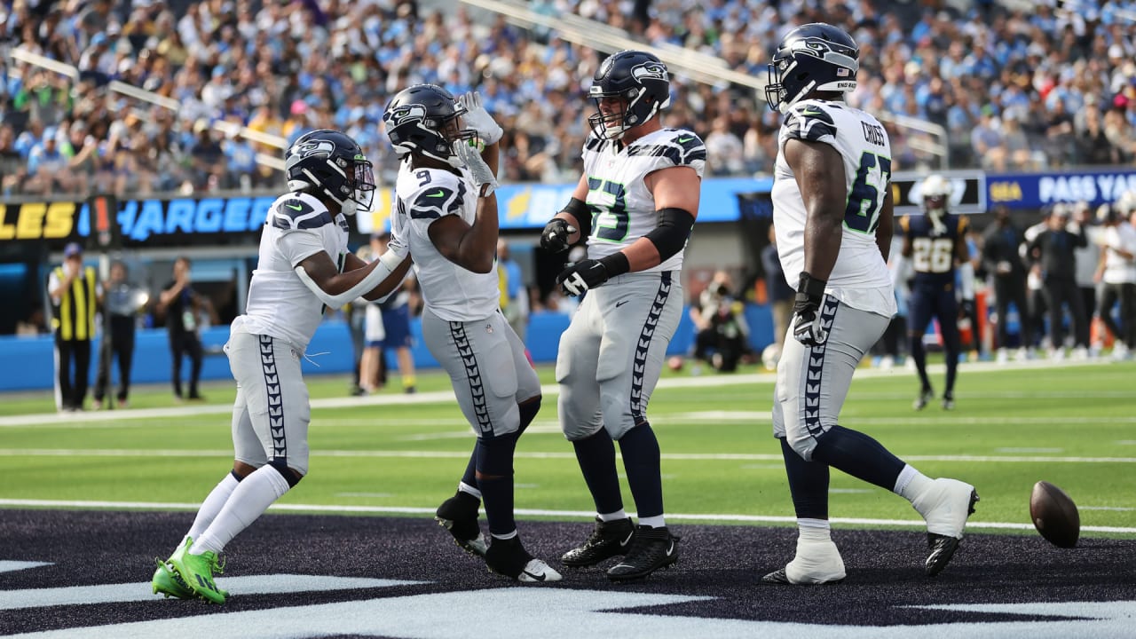 Seahawks LB Darrell Taylor runs onto the field after an interception,  giving Seattle a real 12th man 