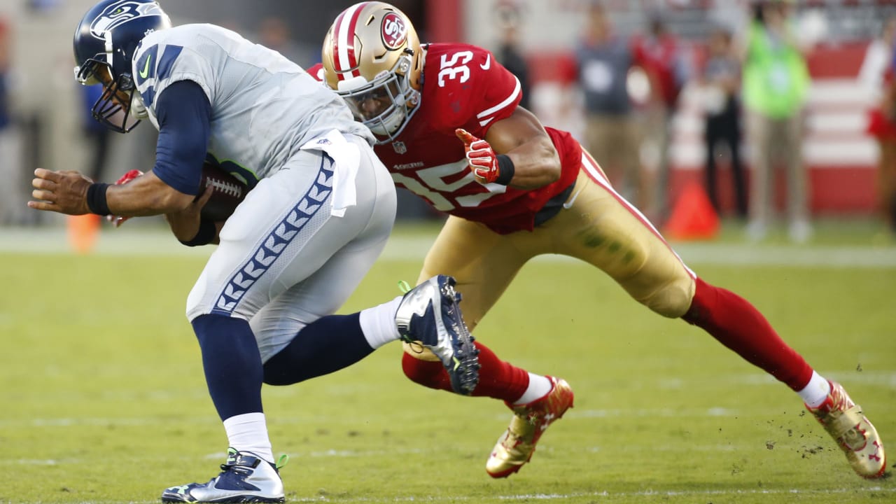 San Francisco 49ers tight end George Kittle (85) greets wide receivers  Chris Thompson (89) and …