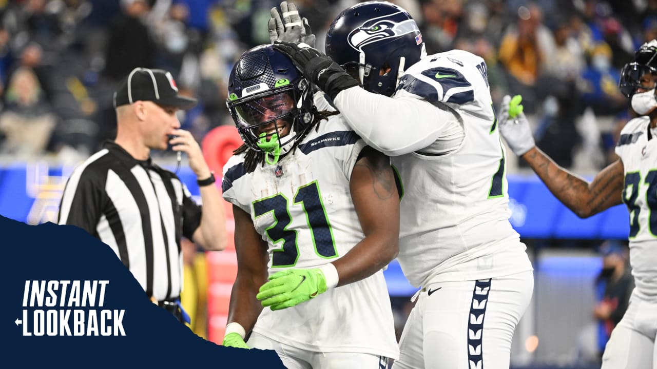 DeeJay Dallas of the Seattle Seahawks gestures to the fans during