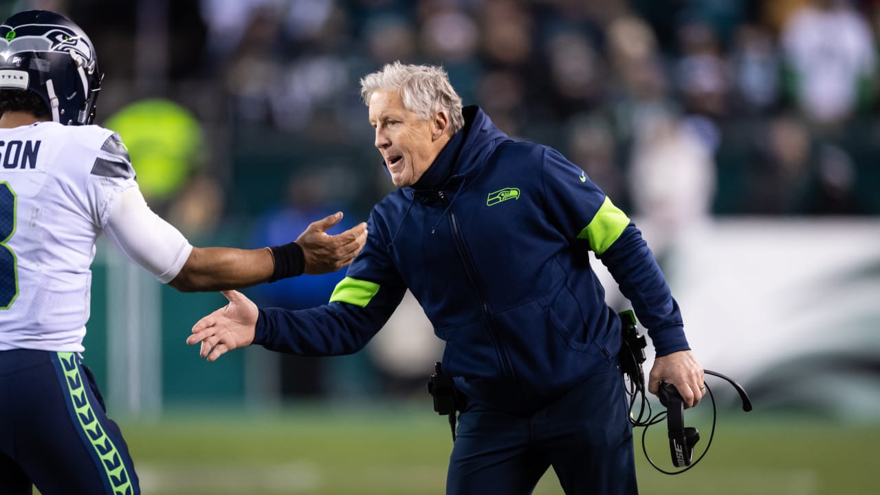 Tre Flowers of the Seattle Seahawks leans his head on the goal