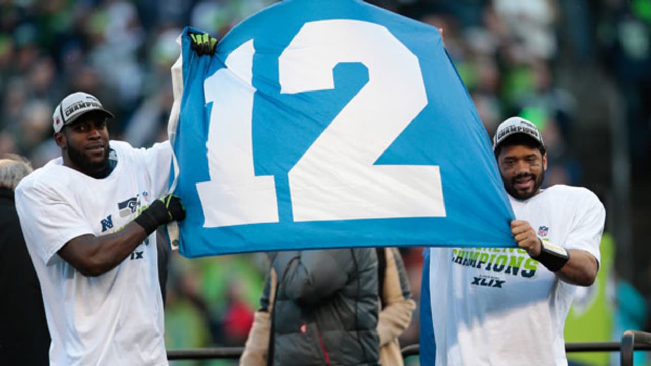 A Seattle Seahawks fan shows off her 12th Man boots before the start of a  game against the Green Bay Packers in the NFC Championship game at  CenturyLink Field in Seattle, Washington