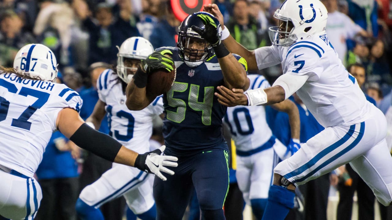 Seattle Seahawks' linebacker D.D. Lewis (54) hits Indianapolis Colts' wide  receiver Troy Rogers as he catches the ball during the second quarter of an NFL  football game Saturday, Dec. 24, 2005 in