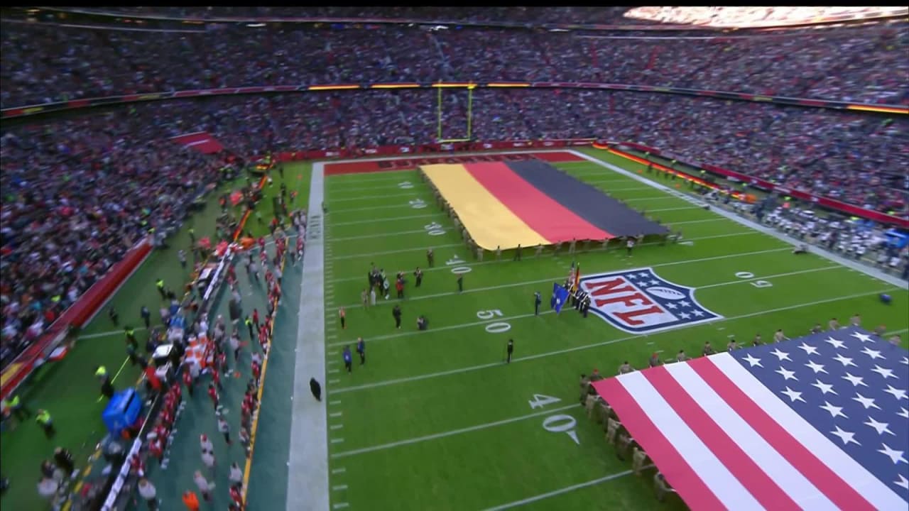 The United States flag is displayed on the field during the singing of the  national anthem before an NFL football game between the Tampa Bay  Buccaneers and the Seattle Seahawks at Allianz